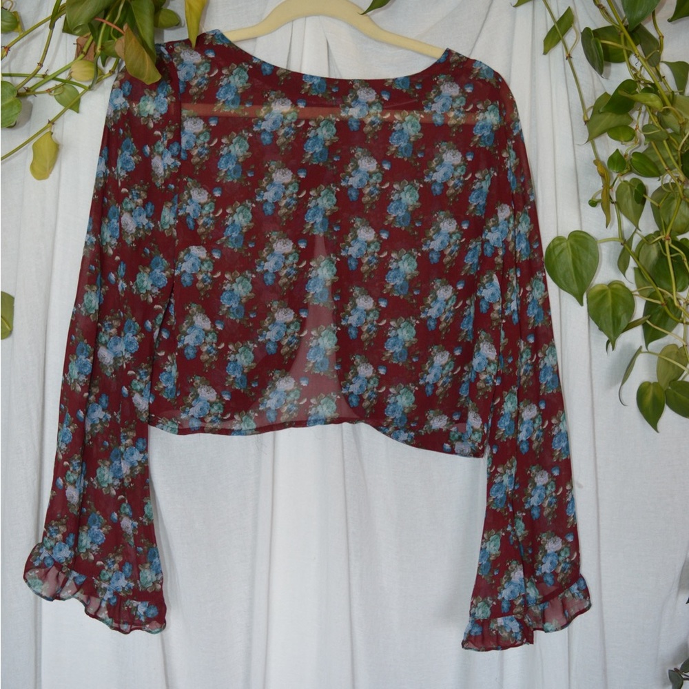 70s style sheer floral crop top with ruffled bell sleeves and slit back